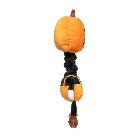 Zijaanzicht van een pluche pompoenfiguur als hondenspeeltje met lange zwarte nek en oranje tuinbroek