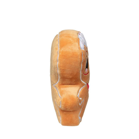 Zijaanzicht van een klein pluche peperkoekfiguur als hondenspeeltje met glazuur